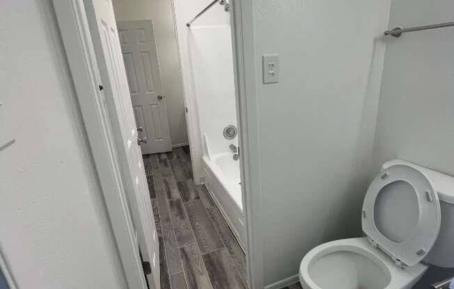 a small bathroom with a toilet and a shower