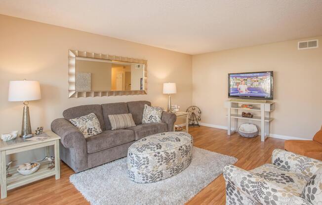 a living room filled with furniture and a fireplace