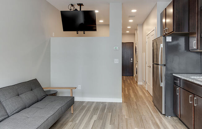 a living room with a couch and a tv