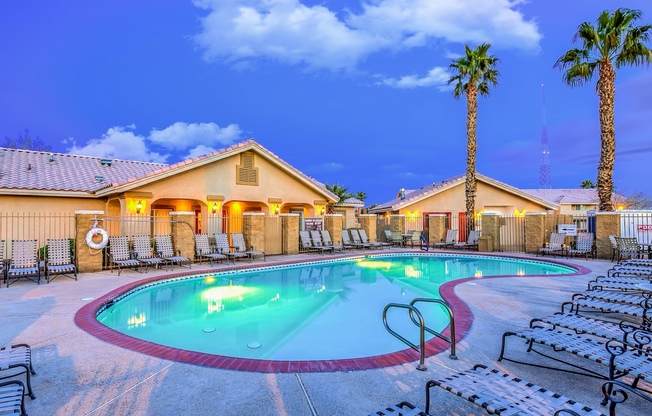 North Las Vegas Apartments - Portola Del Sol - Expansive Pool with Surrounding Lounge Chairs
