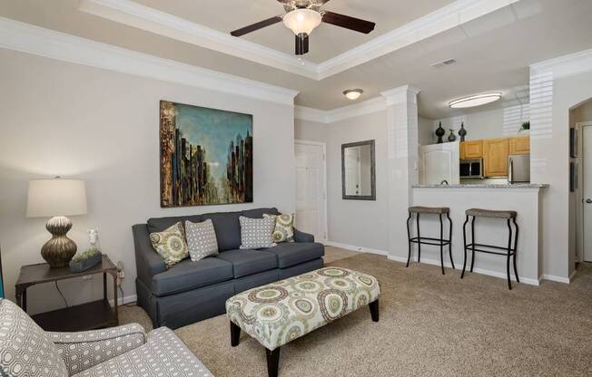 Well appointed living rooms with crown moulding and opens to kitchens