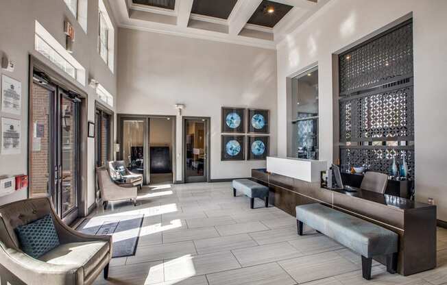 a lobby with a seating area and a reception desk at Volare at the Woodlands, The Woodlands, Texas