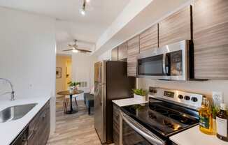 apartment kitchen with stainless steel appliances at Paisley and Pointe Apartments, Las Vegas