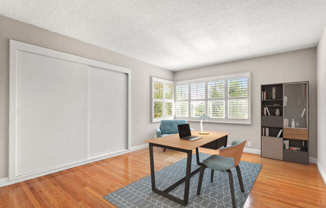 a home office with a desk and chair