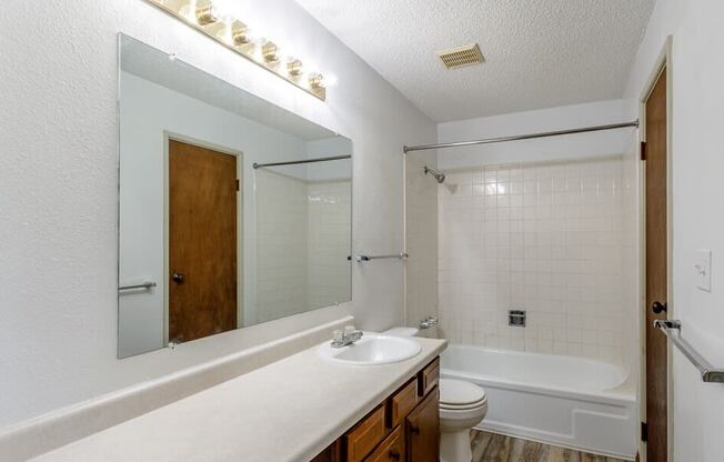 a bathroom with a sink toilet and bathtub