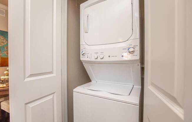 a microwave oven sitting on top of a refrigerator