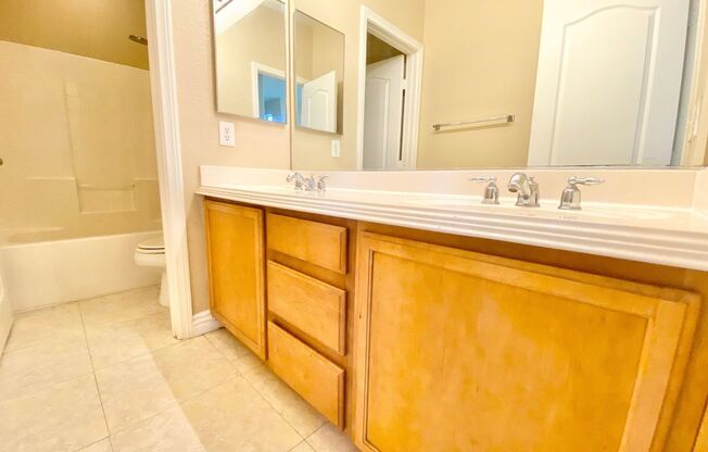 THIS SPACIOUS RESIDENCE FEATURES 4 BEDROOMS, 3 BATHROOMS, AND A WELL-THOUGHT-OUT LIVING SPACE DESIGNED FOR BOTH COMFORT AND FUNCTIONALITY. ENJOY A BRIGHT, OPEN FLOOR PLAN WITH HIGH CEILINGS, TILE AND LAMINATE FLOORING THROUGHOUT, AND A MODERN KITCHEN EQU