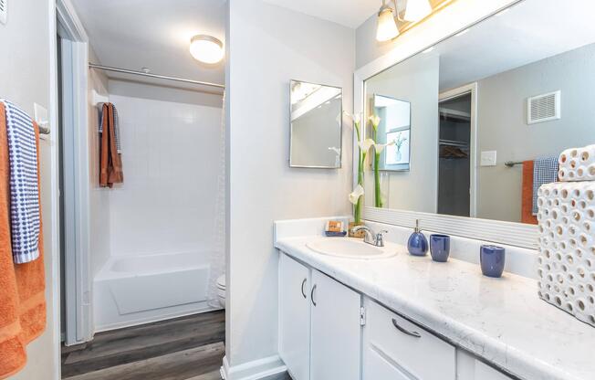 a kitchen with a sink and a mirror