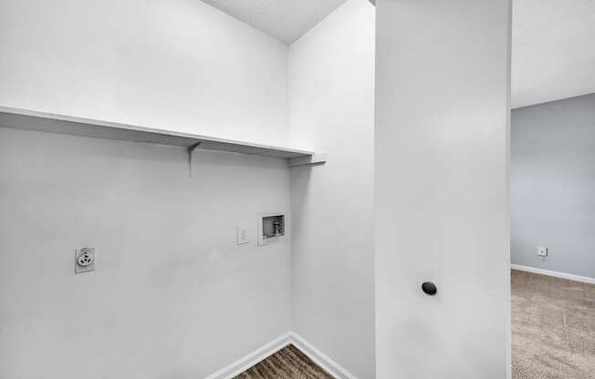 the living room of our studio apartment atrium with white walls and a lowered ceiling