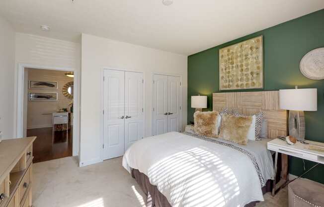 Bedroom with closet and carpet; hallway bathroom