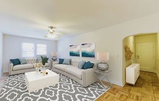 living area with sofa, coffee table, ceiling fan and view of foyer at meridian park apartments in washington dc
