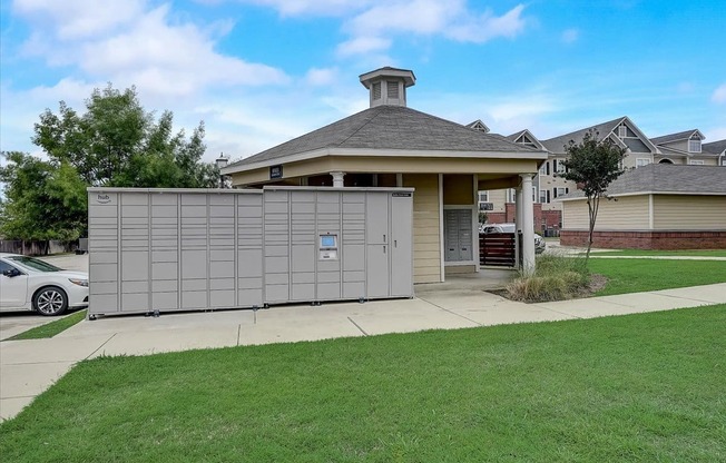 a garage with a fence in front of a house