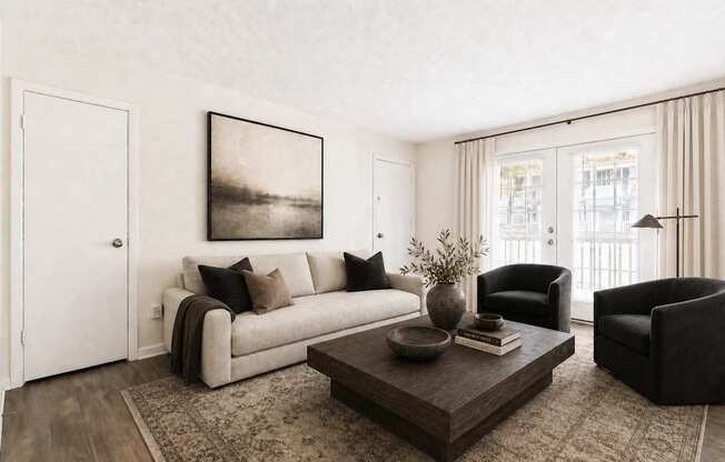 A living room with a couch, chair, and coffee table.