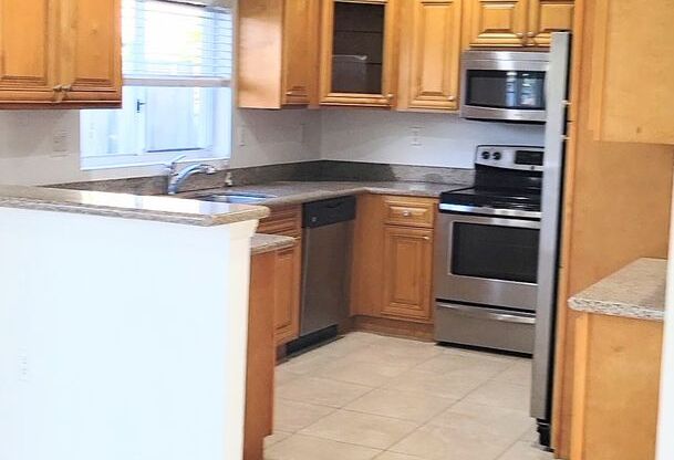 Single-story, 3/2.5 corner lot located near multiple FL Turnpike exits