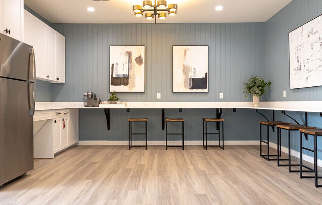 a kitchen with a long counter and stools at Sunset Canyon, San Antonio, TX