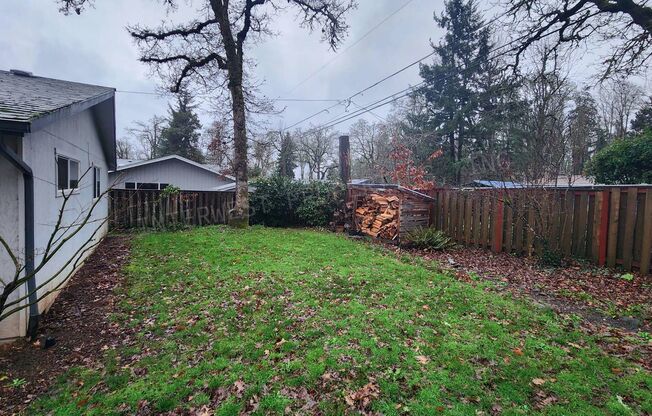 3 bd 2ba Ranch Style Home with Fenced Yard, W/D in Unit, Fireplaces & 2 Car Garage!