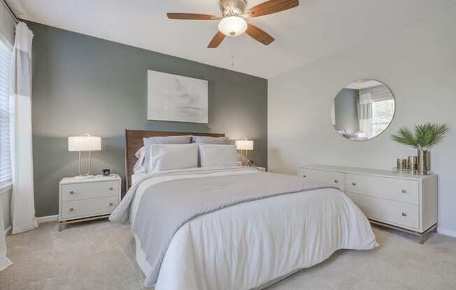 Master bedroom green accent wall ceiling fan