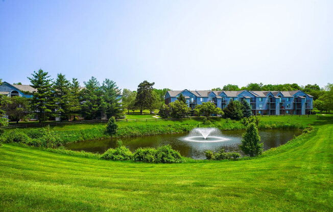 Acres of Green Lawns with a Pond at Green Ridge Apartments, Grand Rapids