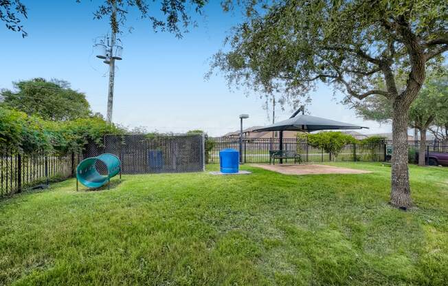 a park with a playground and a picnic table