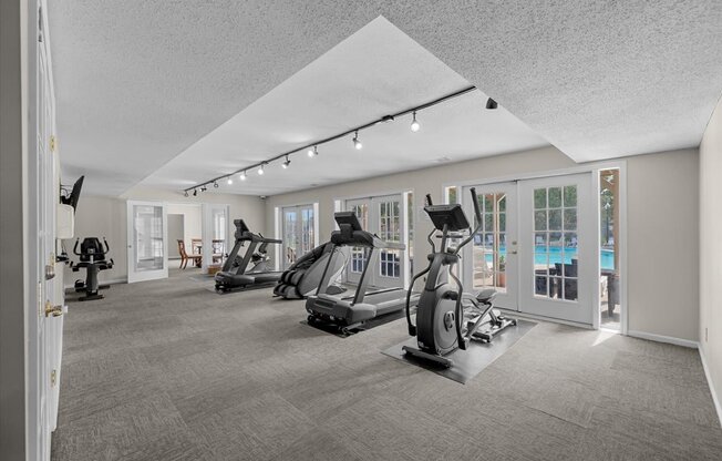 A spacious gym with a variety of exercise equipment.