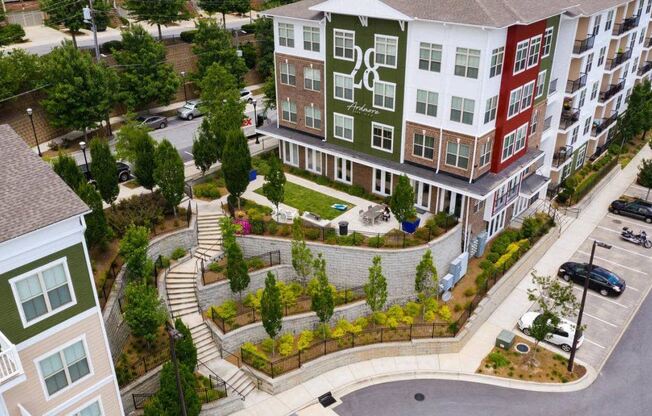 an aerial view of an apartment complex with a landscaped courtyard