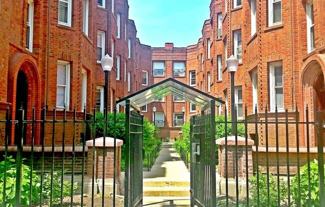 Stunning brick exterior with lovely courtyard