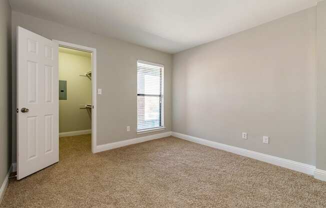 an empty bedroom of Vine apartment in Arlington, TX