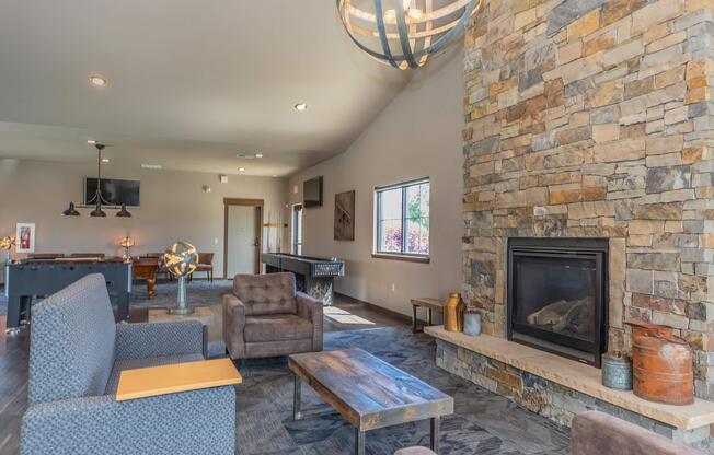 a living room filled with furniture and a fire place