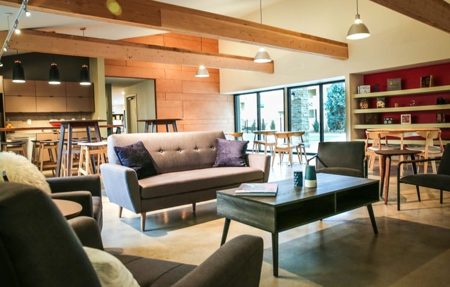 a living room with couches and chairs and a coffee table