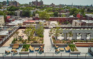 birds eye view of outdoor 9th floor pool terrace with chaise lounges and gathering places 