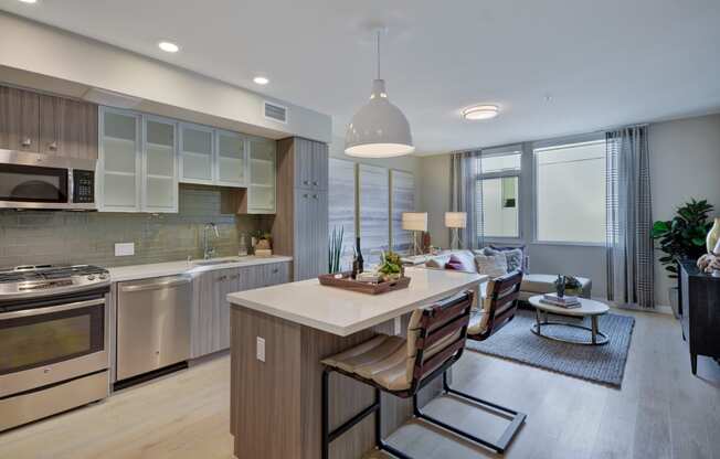 a kitchen and living room with a table and chairs at L Seven, CA 94103