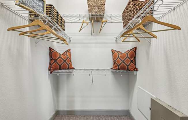 Walk-in closet with ample shelving and storage space at Allusion at West University apartments in Houston, TX