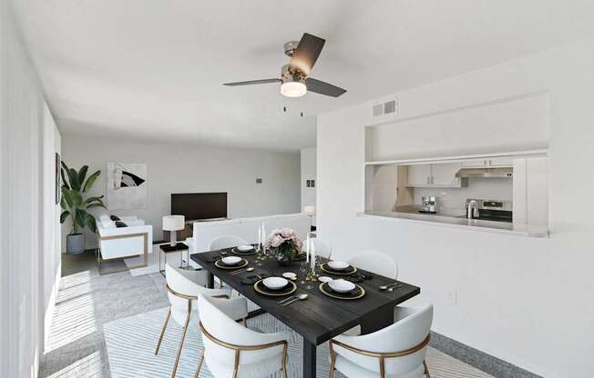 A modern dining room with a black table set for two.