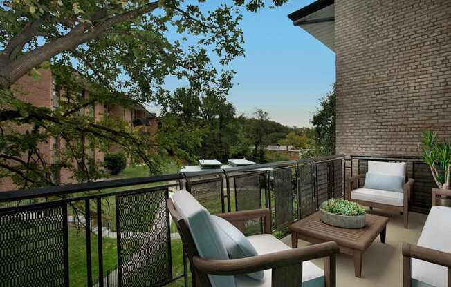a porch with chairs and a table on a balcony