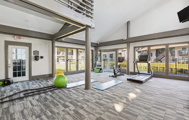 Community Fitness Center with Equipment at Seven Lakes at Carrollwood Apartments in Tampa, FL.