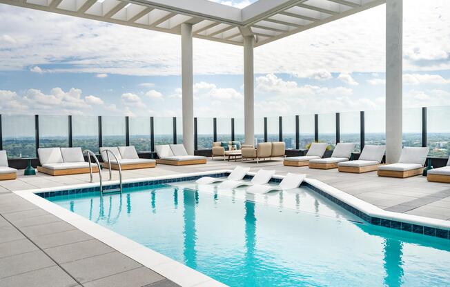 Modera Parkside's rooftop pool with in-water loungers and open-air seating offers a relaxed escape, overlooking Atlanta.