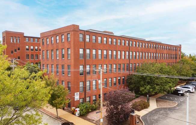 an overhead view of a large brick building with many windows