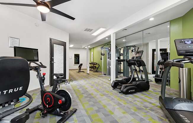 Community Fitness Center with Equipment at Crystal Creek Apartments in Phoenix, AZ.