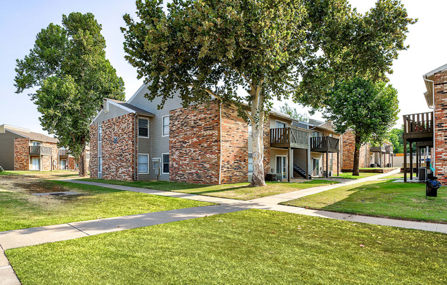 our apartments have a spacious courtyard with trees and grass