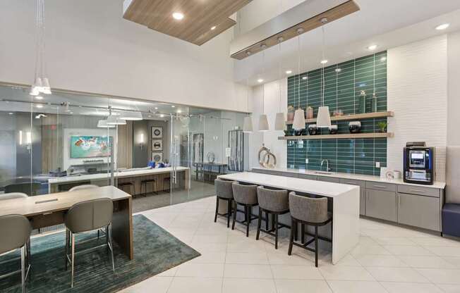 A modern kitchen with a dining table and chairs.