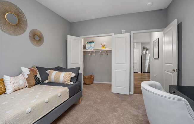 a bedroom with two beds and a closet