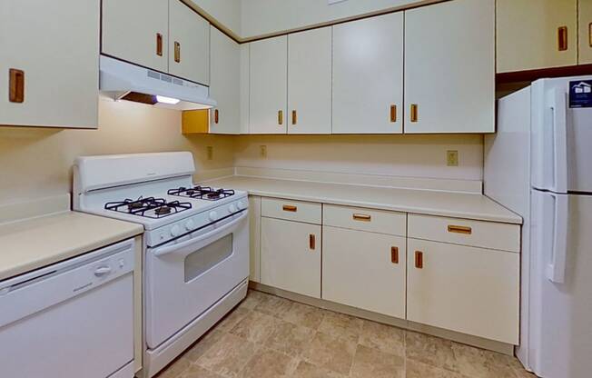 Kitchen With Gas Range and Dishwasher at Arbor Lakes Apartments, Elkhart, IN