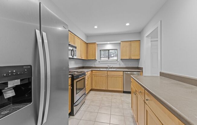 AVAILABLE NOW - Updated 2 Bedroom Duplex w/ Fenced-in Backyard, Large Deck, LVP Floors, Pet Friendly!