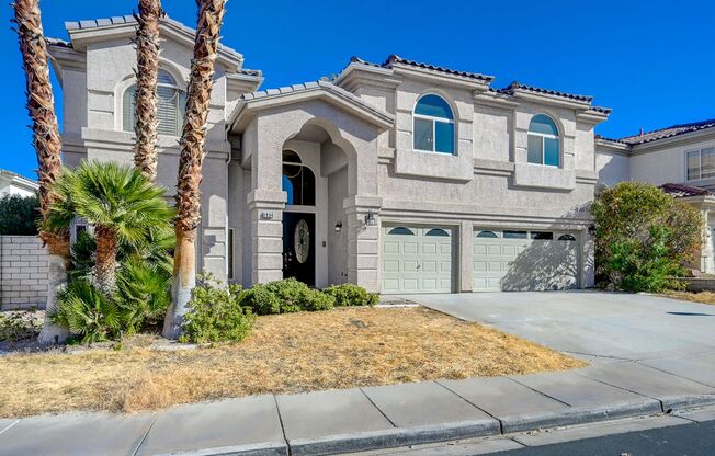 Stunning Green Valley home with a pool in guard gated Legacy