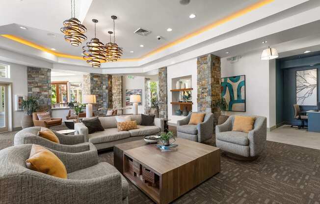 a living room with couches and chairs and a coffee table