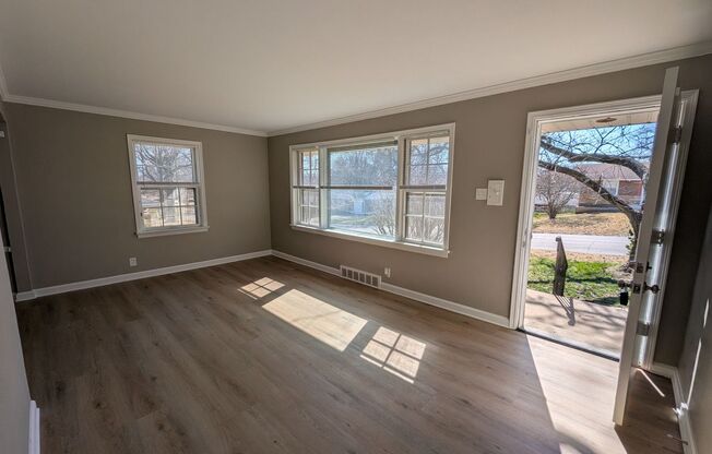 Fully Renovated Home with Sunroom, Garage & Huge Fenced Yard