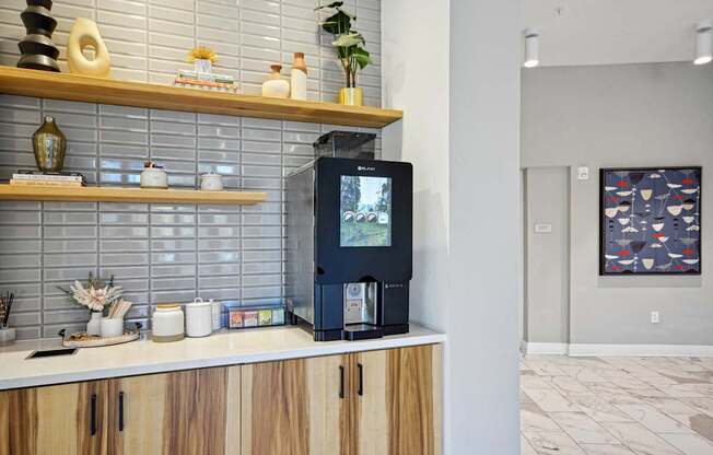 a coffee machine sitting on a counter in a kitchen at Link Apartments® Calyx, North Carolina