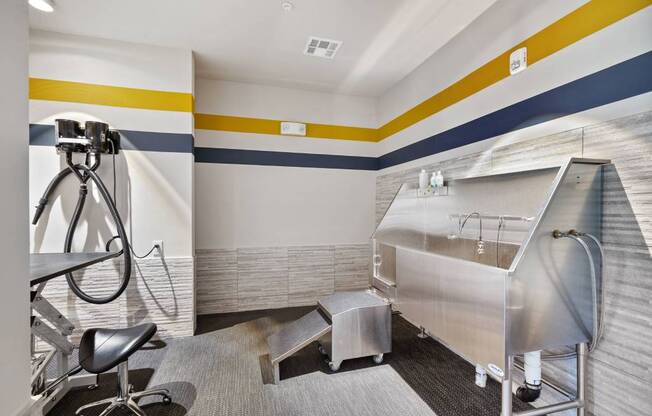 a bathroom with a tub and a sink and a tripod