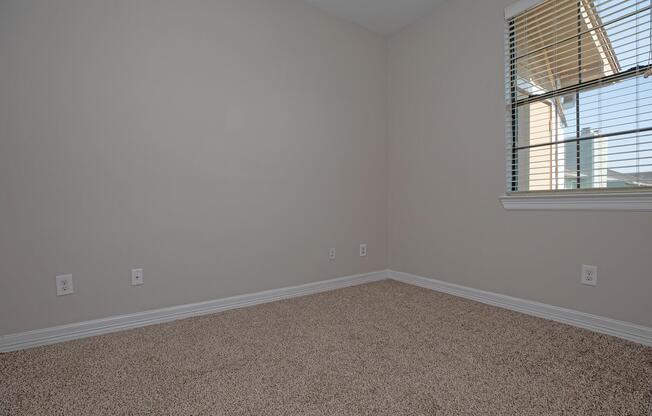 a bedroom with a large window