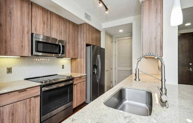 Venue Museum District | Houston, TX | Kitchen w/ Stainless Steel Appliances